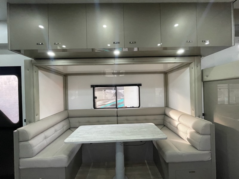 Custom truck living fit-out with seating, shower and cabinetry
